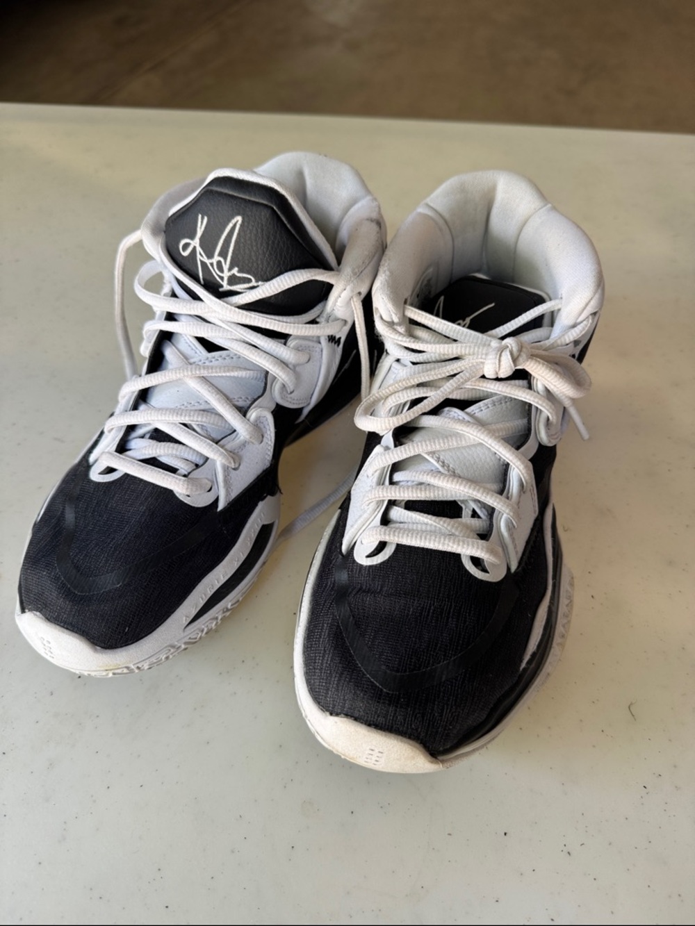 Nike Kyrie Black and White Men's High-Top Athletic Sneakers